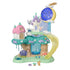 Calico Critters Woodland Wonder Fairy Castle features a teal tree base, pink-roof cottage, white castle, blue moon, yellow slide, clouds, fairy figure, and tiny accessories.