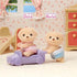 Calico Critters Yellow Labrador twin figures named Shiloh and Marley, each 1.5 inches tall, posed with a lavender toy car inside a floral-themed dollhouse bedroom set.