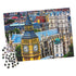 Partially assembled 1000-piece Cardinal jigsaw puzzle of Big Ben and Westminster Abbey, with vibrant golden tower, blue rooftops, and scattered loose pieces on white surface.