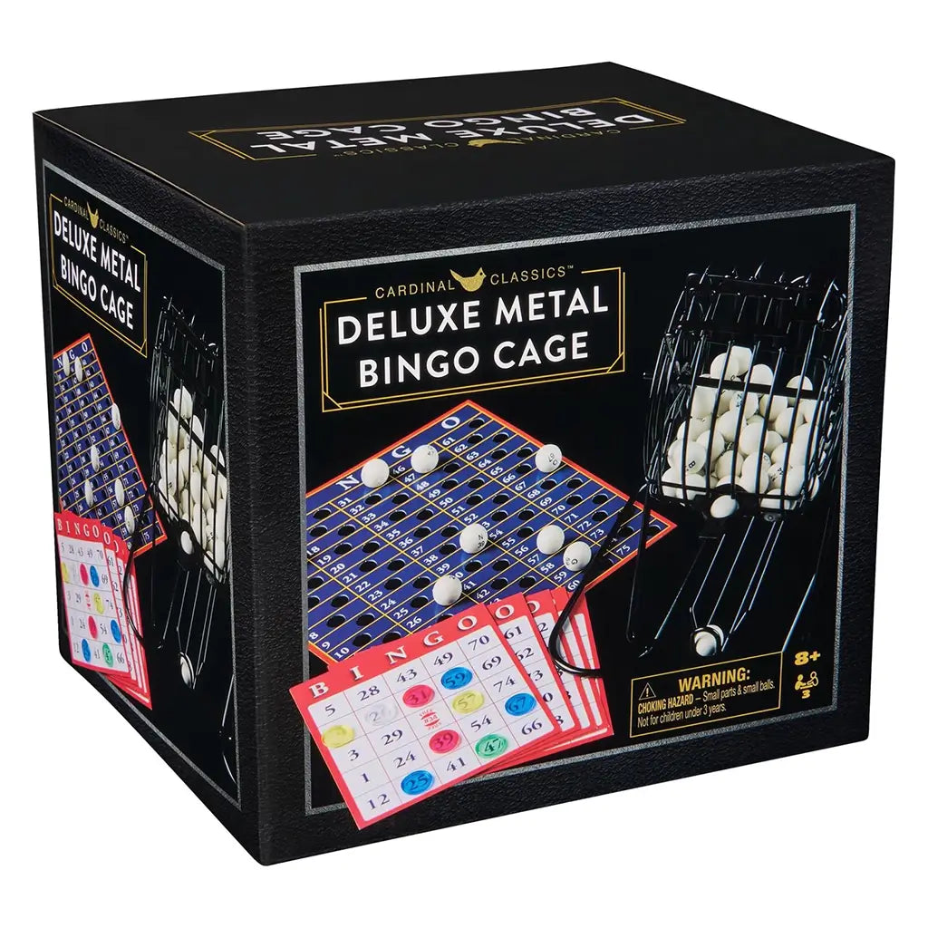 Angled view of the Cardinal Classics Deluxe Metal Bingo Cage box showing the rotating cage, numbered bingo balls, and multi-colored scorecards against a black background.