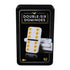 Close-up of the Cardinal Classics Double-Six Dominoes tin package showing a black textured case with an image of a white domino tile with yellow dots and gold-accented label design.