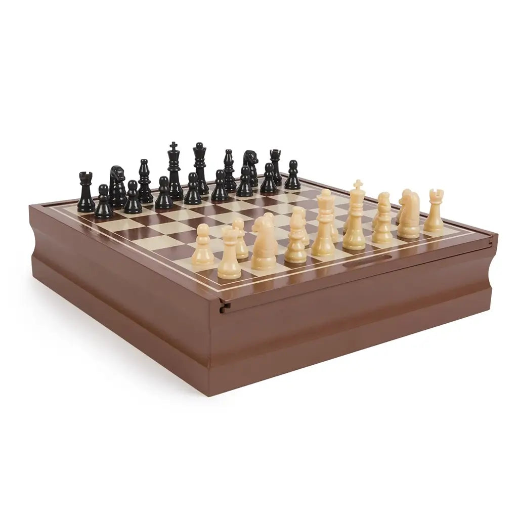 Cardinal Classics Chess set on a brown wooden storage case with cream and tan squares, glossy black and ivory sculpted pieces arranged for classic strategy board play.