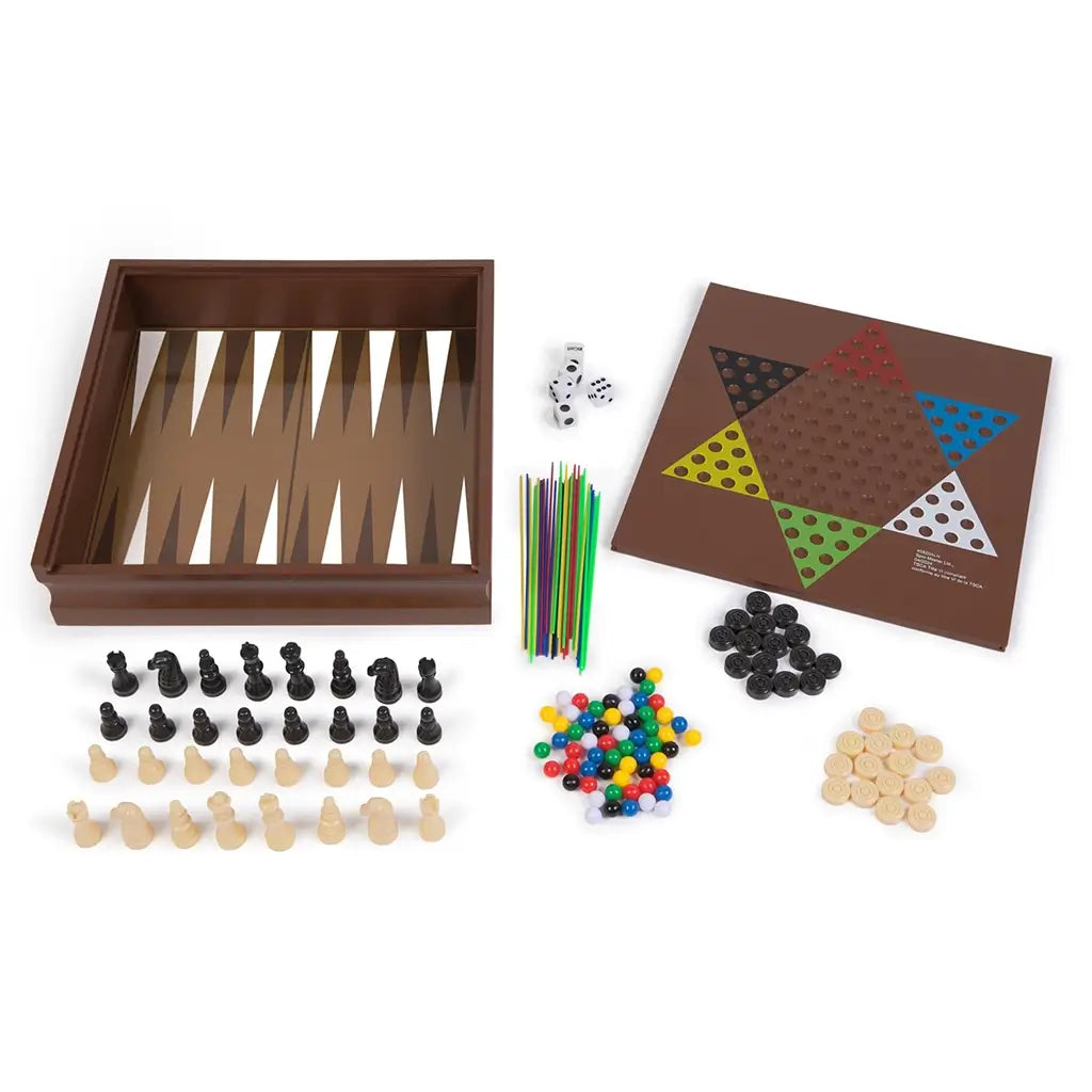 Cardinal Classics Family 10-Game Set components displayed with wooden backgammon board, chess pieces, colorful marbles, pick-up sticks, dice and round checkers arranged on a white background.