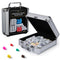 Cardinal Classics Mexican Train Dominoes set in a silver aluminum carrying case with black panel label, white domino tiles and colorful plastic train markers displayed beside the open storage box on a white background.