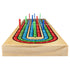 Side perspective of the solid wood Cribbage board with colorful scoring pegs inserted into numbered tracks, displaying durable craftsmanship and classic game layout.