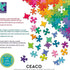 Back of Ceaco puzzle box with rainbow-colored jigsaw pieces and multilingual text highlighting recycled materials, handcrafted die cuts, and USA manufacturing.