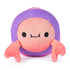 Front view of a reversible 6-inch plush toy shaped like a crab with pink claws, peach face, and purple shell, designed with a smiling expression and soft fabric texture.