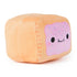 Angled view of Cheeky Chonks Poppin Booty plush toy, showing soft peach sides and happy pink frosted pastry face with colorful sprinkles and blushing cheeks.
