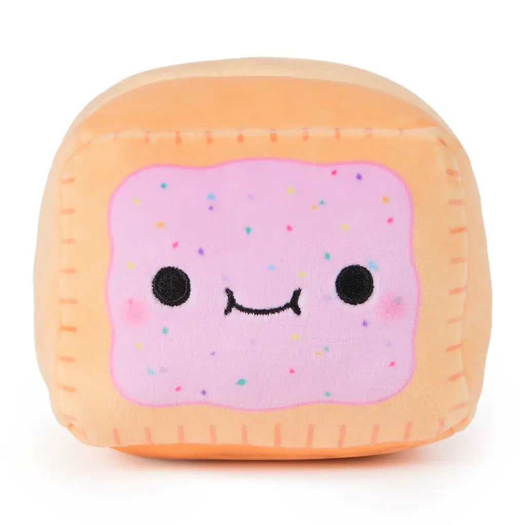 Front view of Cheeky Chonks Poppin Booty reversible plush shaped like a toaster pastry, with pink frosting, sprinkle details, and a cute embroidered face.