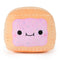 Front view of Cheeky Chonks Poppin Booty reversible plush shaped like a toaster pastry, with pink frosting, sprinkle details, and a cute embroidered face.