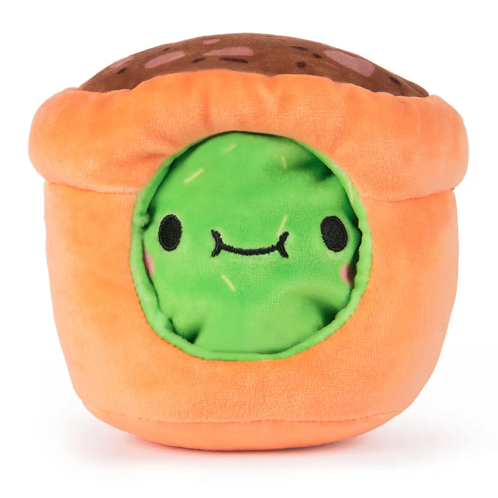 Reversed view of Cheeky Chonks Prickly Pants 6-inch plush toy, showing green cactus face inside a soft orange pot with a brown top resembling soil.