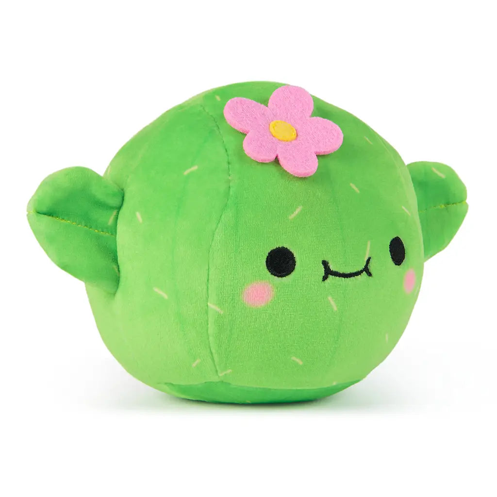 Side angle view of Cheeky Chonks Prickly Pants plush, shaped like a green cactus with stitched arms, pink cheeks, and a felt flower on its head.