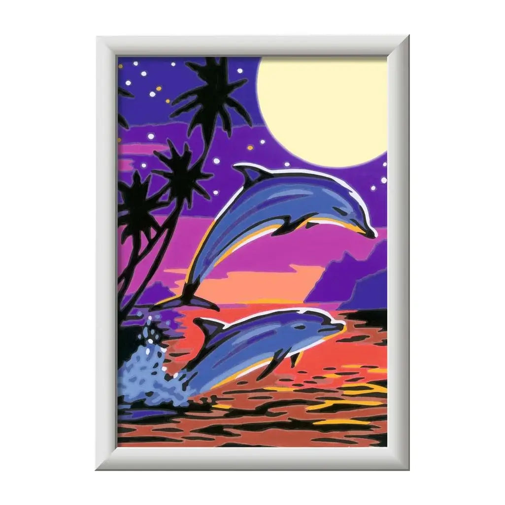 Completed CreArt dolphin painting showing two dolphins leaping against a tropical sunset with palm trees and a glowing moon in a vivid ocean landscape.