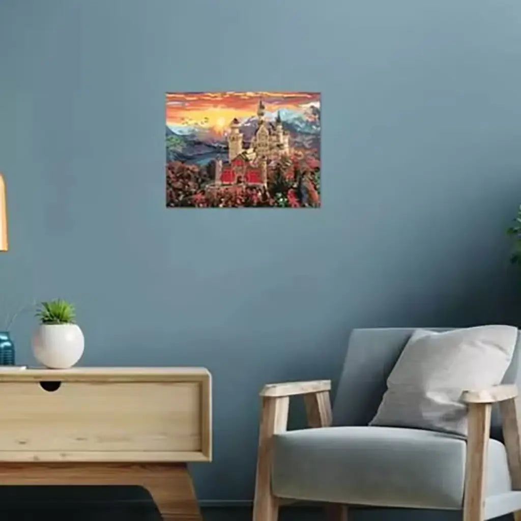 Fairytale castle paint by numbers artwork displayed on a modern blue wall above a wooden side table and armchair, adding a warm decorative touch to the living room space.