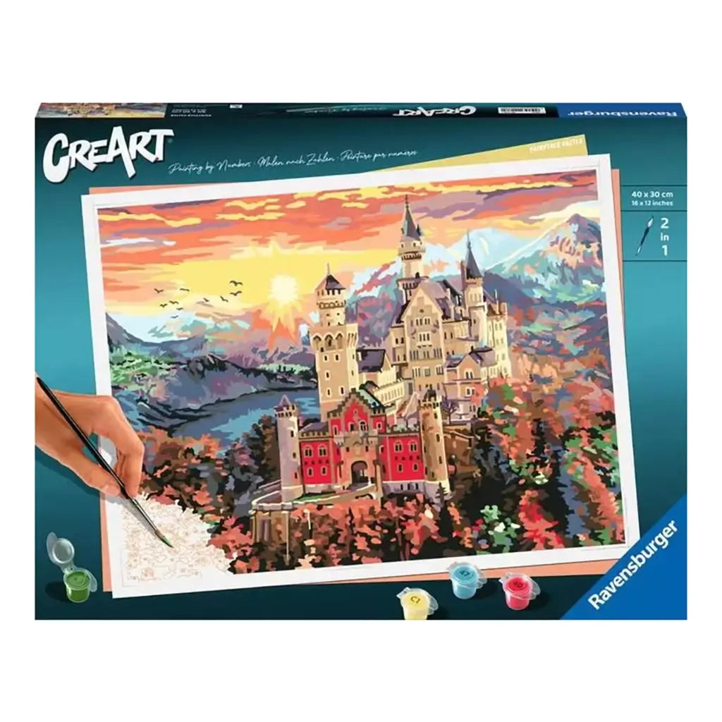 Ravensburger CreArt paint by numbers kit box shows fairytale castle artwork in sunset colors, including brush and paints, emphasizing a relaxing creative activity set.