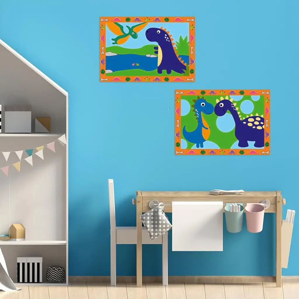 Children’s playroom with bright blue wall decorated with framed dinosaur paintings, one with flying pterosaur and another with smiling dinosaurs, above a small wooden desk.