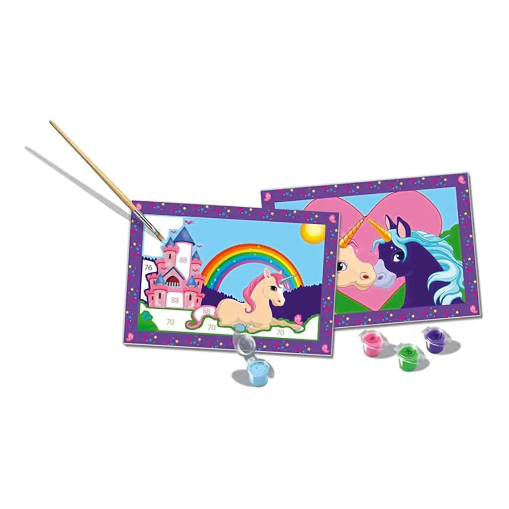 Unicorn painting by numbers kit includes two framed canvas sheets, paintbrush, and paint pots, showing rainbow castle unicorn scene and two unicorns facing each other.