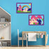Children’s playroom with blue wall displays framed unicorn paintings, one with castle and rainbow and another with two unicorns in front of a heart, above a desk.
