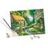Partially completed River Cottage paint by numbers artwork with brush applying paint, showing colorful garden, stream, and trees, alongside small open acrylic paint pots.