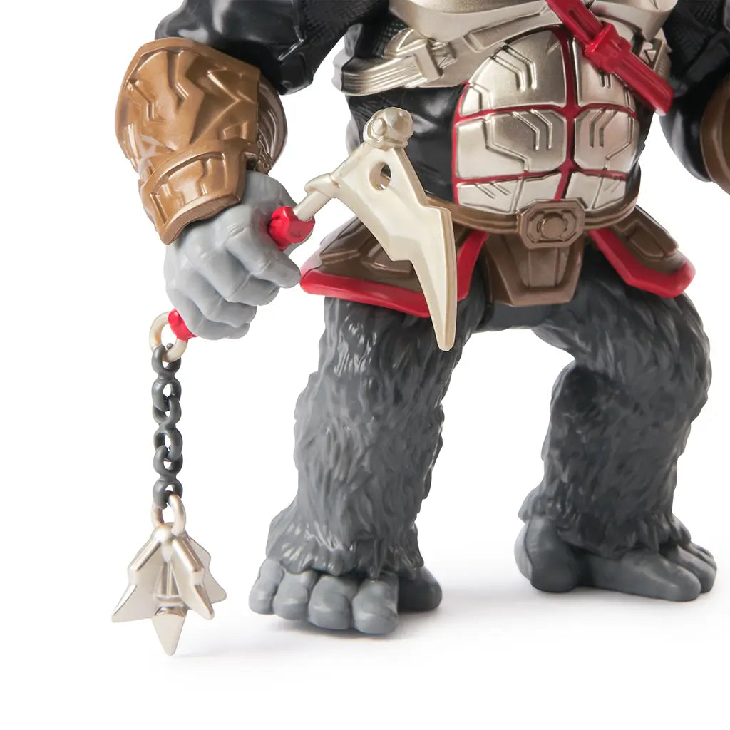Close-up of Gorilla Grodd action figure weapon featuring a gold axe with red handle and silver chain with star-shaped flail, designed for imaginative battle scenes.