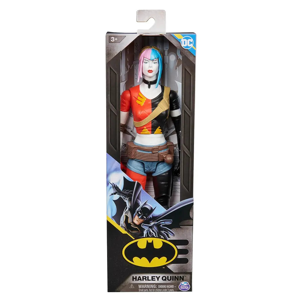 DC Comics Harley Quinn 12-inch action figure packaged in display box with Batman logo, showing detailed costume design, bright hair colors, and accessory belt.