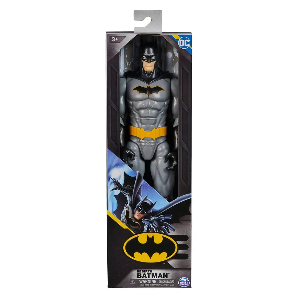 DC Comics Batman action figure in gray and black suit with yellow utility belt, displayed in retail box packaging with comic artwork and logo, ideal for collectors and kids.