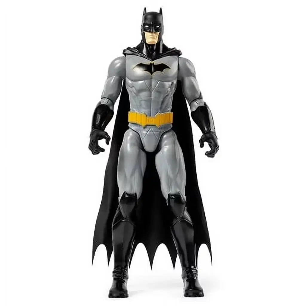 DC Comics Batman 12-inch action figure wearing gray bodysuit, black boots, gloves, and cape with yellow utility belt, shown standing upright in a front-facing pose against a plain background.