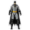 DC Comics Batman 12-inch action figure wearing gray bodysuit, black boots, gloves, and cape with yellow utility belt, shown standing upright in a front-facing pose against a plain background.