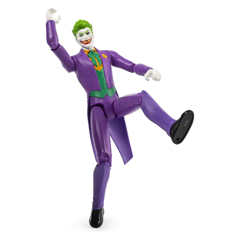 Poseable Joker 12-inch action figure with 11 points of articulation, shown mid-motion raising arm and kicking leg, wearing purple suit with green vest and orange bow tie.