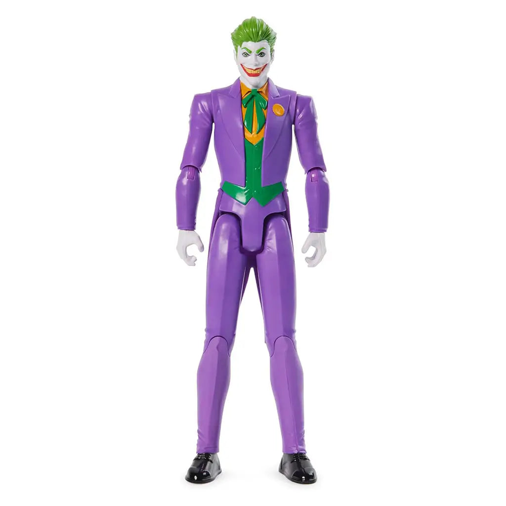 DC Comics The Joker 12-inch action figure front view with green hair, white face, purple suit, green vest, orange shirt, and wide grin, posed upright on plain background.