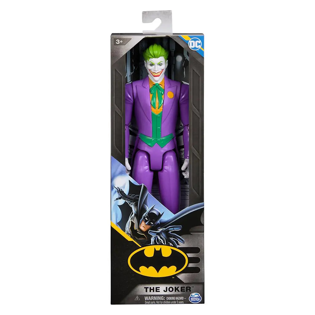 DC Comics Joker 12-inch action figure displayed in retail box with Batman logo, showcasing detailed purple suit, sinister grin, and bright green hair.