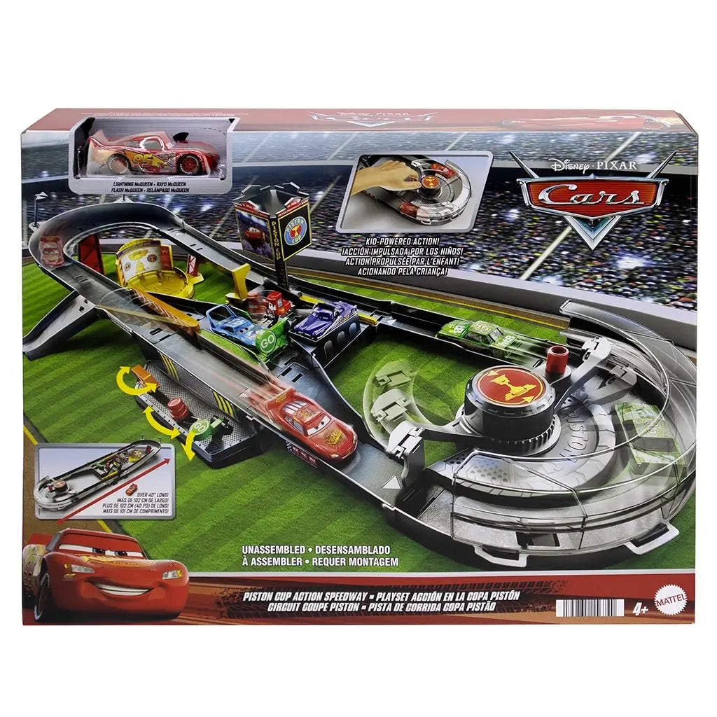 Disney Pixar Cars Piston Cup Action Speedway packaging showing the assembled dark gray track, booster, pit area, and Lightning McQueen car, with colorful graphics, product photos, and branding on the retail box front.