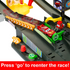 Disney Pixar Cars pit lane detail showing dark gray plastic track, green GO button, yellow barriers, and Lightning McQueen car, illustrating the reentry feature that sends the car back into the Piston Cup race.