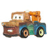 Close-up of Disney and Pixar Cars mini Tow Mater toy featuring a brown and blue tow truck design with mismatched wheels, expressive eyes, and realistic muddy accents.