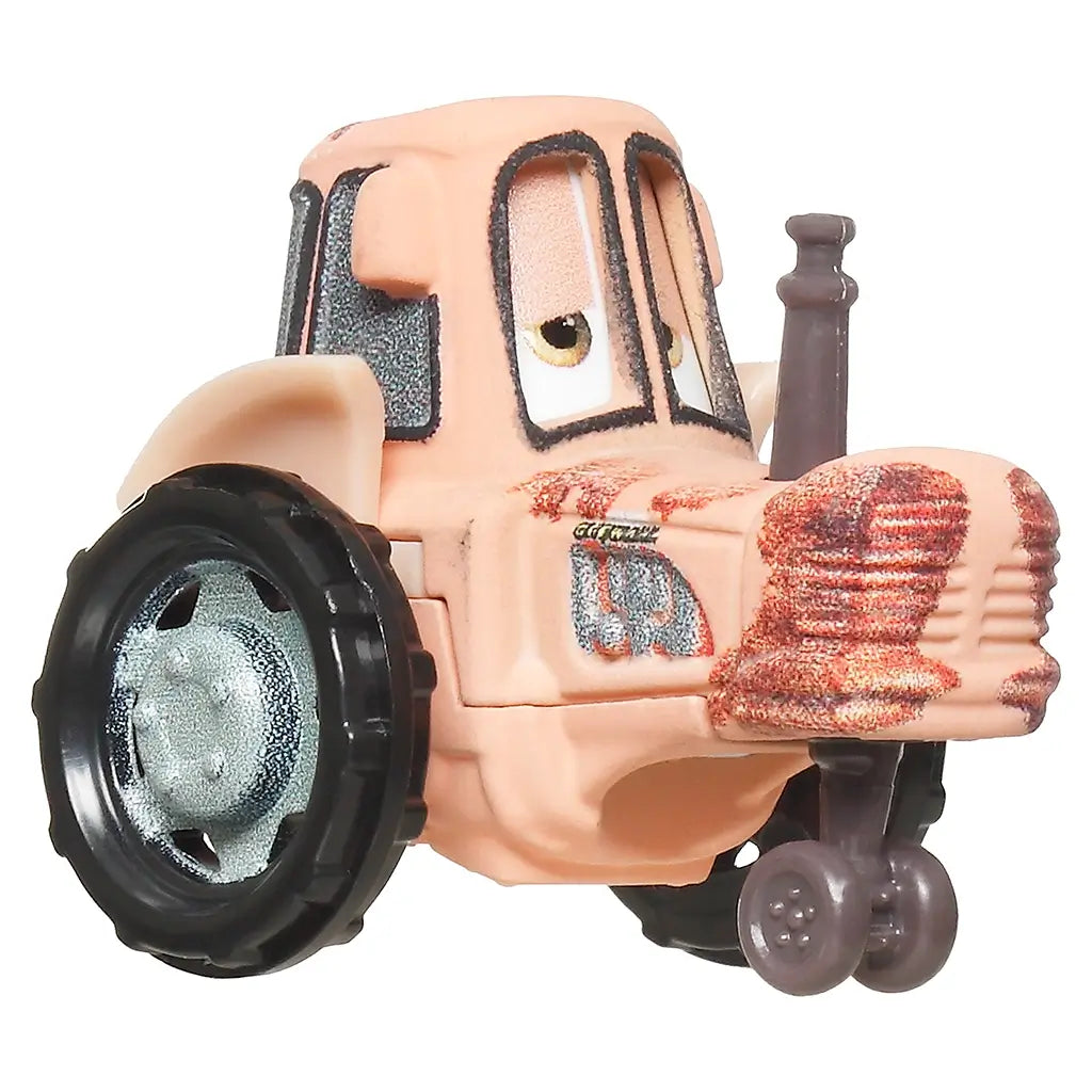 Close-up of Disney and Pixar Cars mini tractor toy in beige with large black wheels, a rusty front grille, and sleepy cartoon eyes, designed for collectible toy car play.