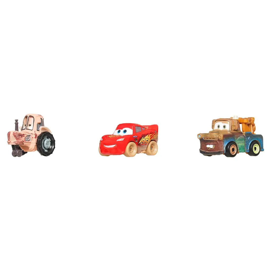 Right angled view of Disney and Pixar Cars mini racers featuring McQueen, Mater, and tractor, highlighting vibrant colors and realistic mud accents for display or play.