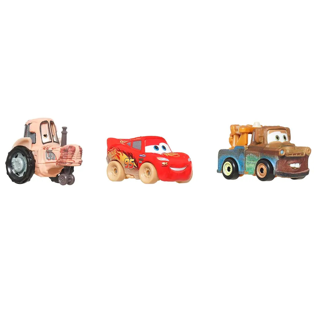 Set of three Disney and Pixar Cars mini metal racers featuring Muddy Lightning McQueen, Tow Mater, and a tractor, displayed on a white background for collectible toy play.