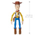 Disney and Pixar Toy Story Woody 12-inch action figure shown upright with labeled height of 12.25 inches or 31.11 cm, wearing cowboy attire and brown boots.