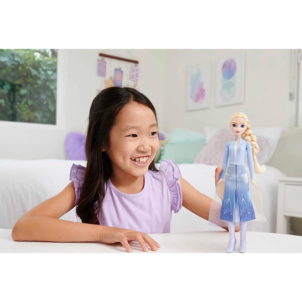 Girl playing with Disney Frozen 2 Elsa Fashion Doll