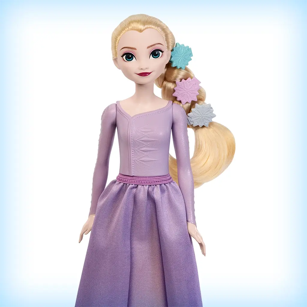 Close-up of Elsa doll included in Disney Frozen Arendelle Castle set, with long blonde hair styled with snowflake clips and wearing a shimmering lavender gown.