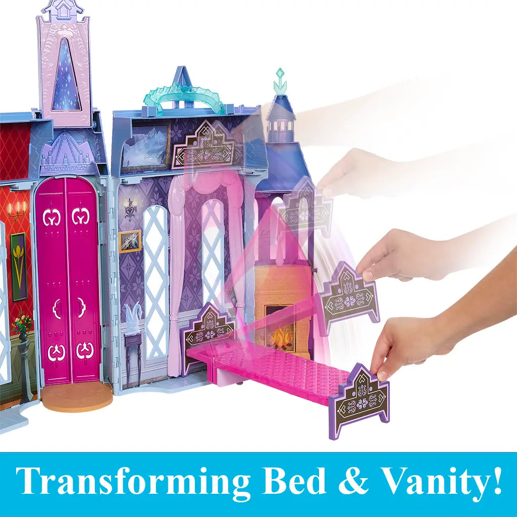 Frozen Arendelle Castle playset showing interactive transforming pink bed that flips into a vanity, with detailed castle walls, tall windows, and a fireplace backdrop.