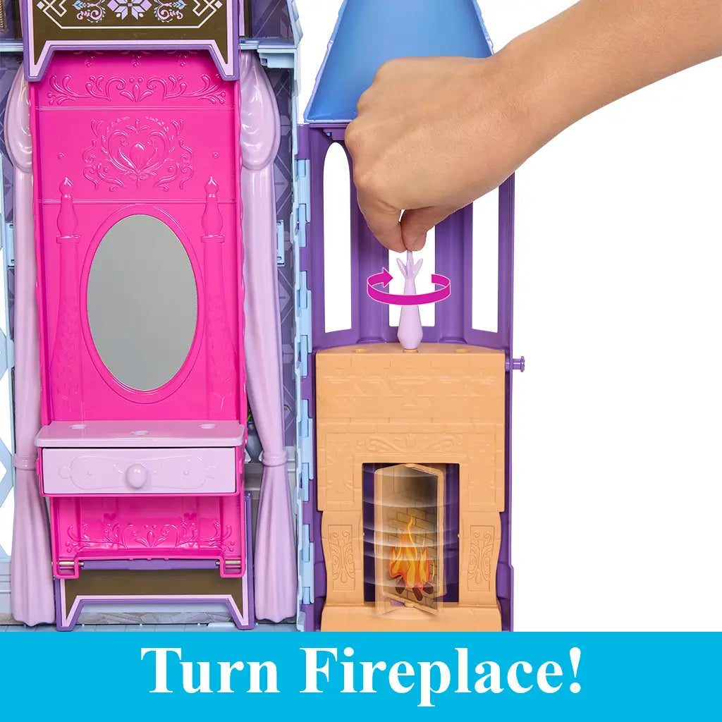 Close-up of Frozen Arendelle Castle playset feature where turning a handle activates the brown and purple fireplace with glowing flame effect beside the vanity mirror.