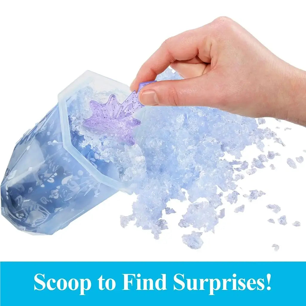 Close-up of a hand scooping through blue squishy ice gel to uncover a glittery purple snowflake accessory from the Disney Frozen Ice Reveal surprise toy playset.