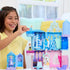 Smiling child plays with Disney Frozen Storytime Stackers Anna’s Arendelle Castle, arranging Elsa and Anna figures inside colorful multi-level blue and pink playhouse.
