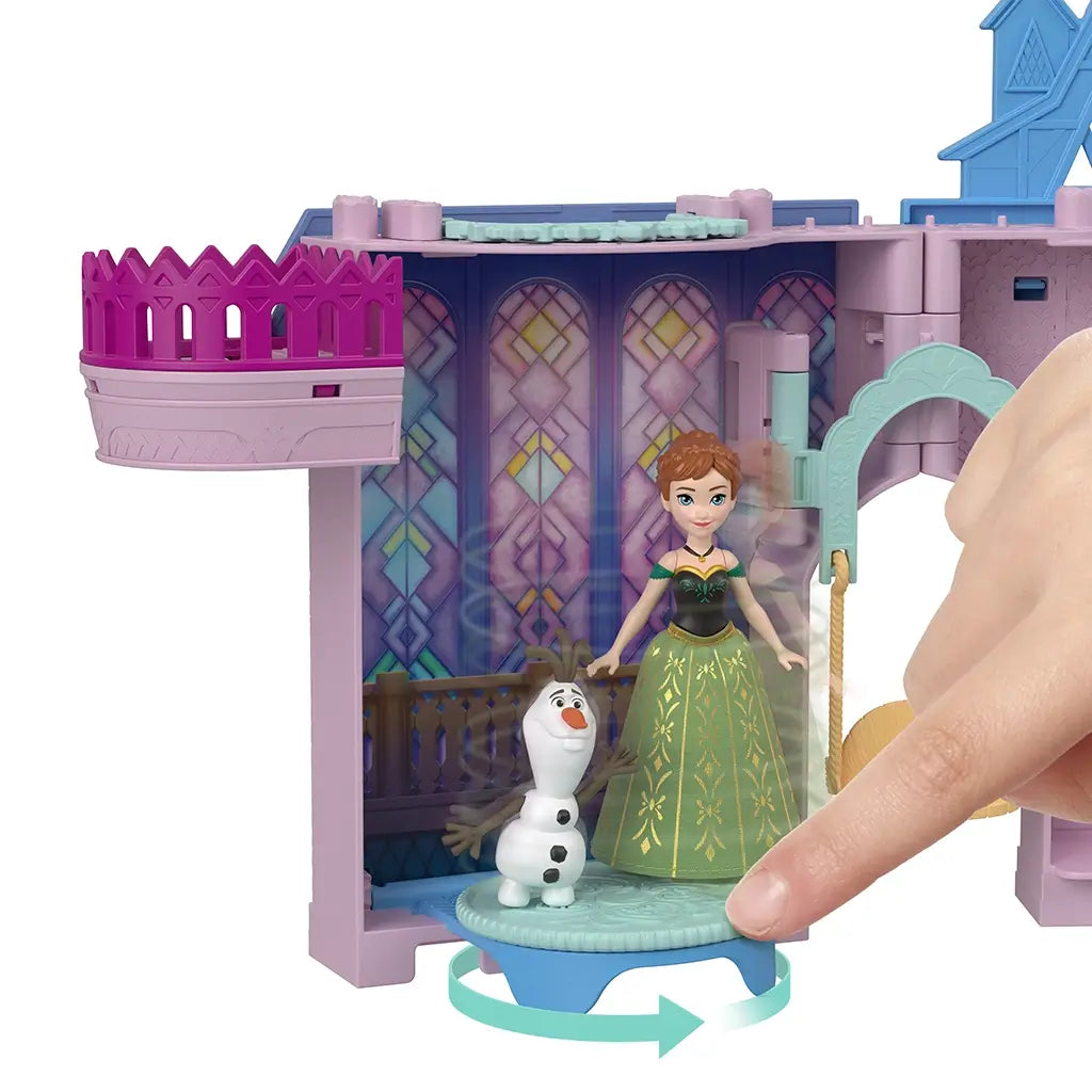 Disney Frozen Storytime Stackers Anna’s Arendelle Castle playset close-up shows Anna and Olaf figures on rotating dance floor with purple stained-glass style backdrop.