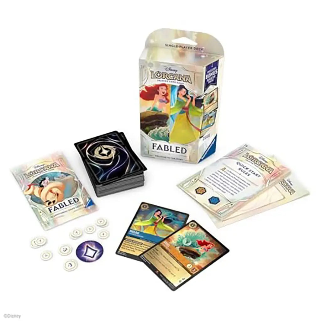 Disney Lorcana Fabled deck set including Mulan and Ariel foil cards, booster pack, rule sheet, damage counters, and card deck arranged neatly beside the packaging.