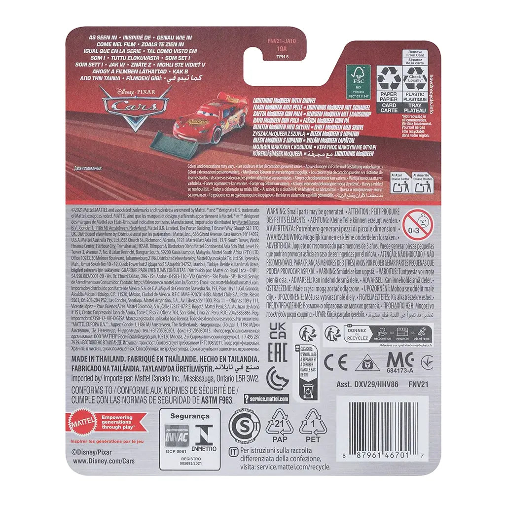 Back of Disney Pixar Cars Lightning McQueen with Shovel packaging showing product details, multilingual text, recycling icons, and small image of red race car diecast with gray shovel.