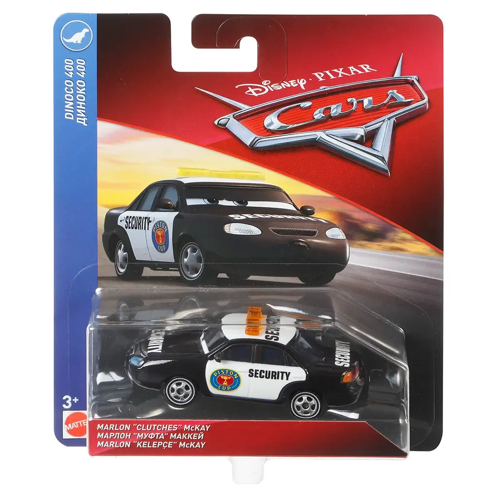 Disney Pixar Cars retail package front with red and blue card, clear plastic blister, and racetrack artwork, displaying the black and white Marlon “Clutches” McKay security car inside, branded with Dinoco 400 and Piston Cup graphics.