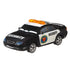 Disney Pixar Cars diecast security car in black and white metal with blue-tinted headlights, amber roof light bar, and compact sedan shape, depicting Marlon “Clutches” McKay from the Piston Cup series on a clean white studio background.