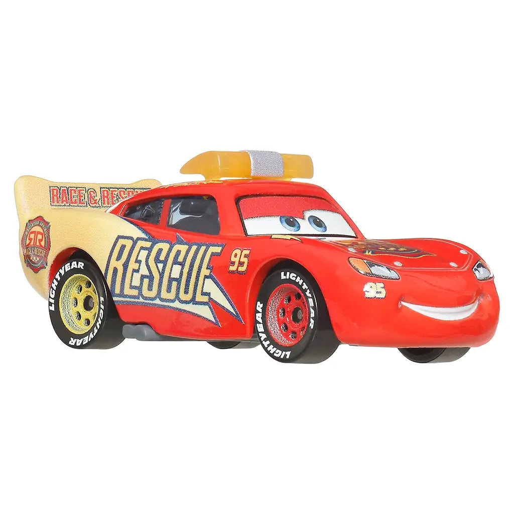 Disney Pixar Cars Lightning McQueen toy in red and tan metal with textured rescue detailing, aerodynamic race car form, bold Rescue 95 decals, yellow light bar, and rolling wheels shown at an angled view.
